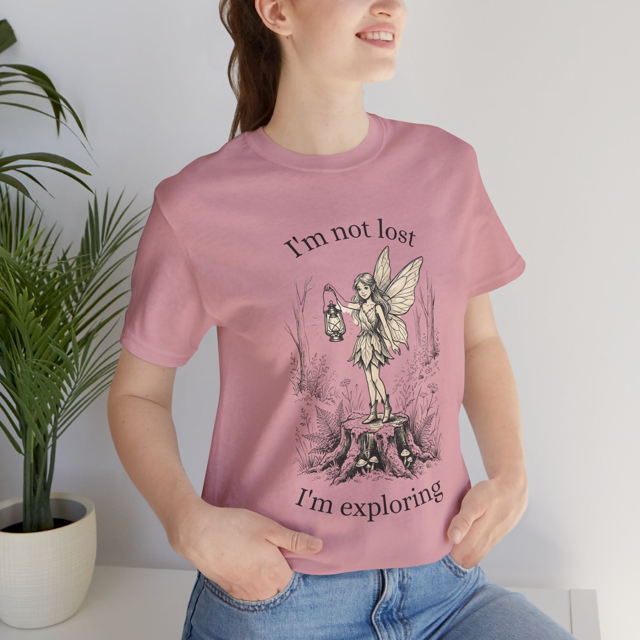 Fairy Exploration T-Shirt by Printify featuring a graphic design with the text “I’m Not Lost, I’m Exploring” on a casual tee.