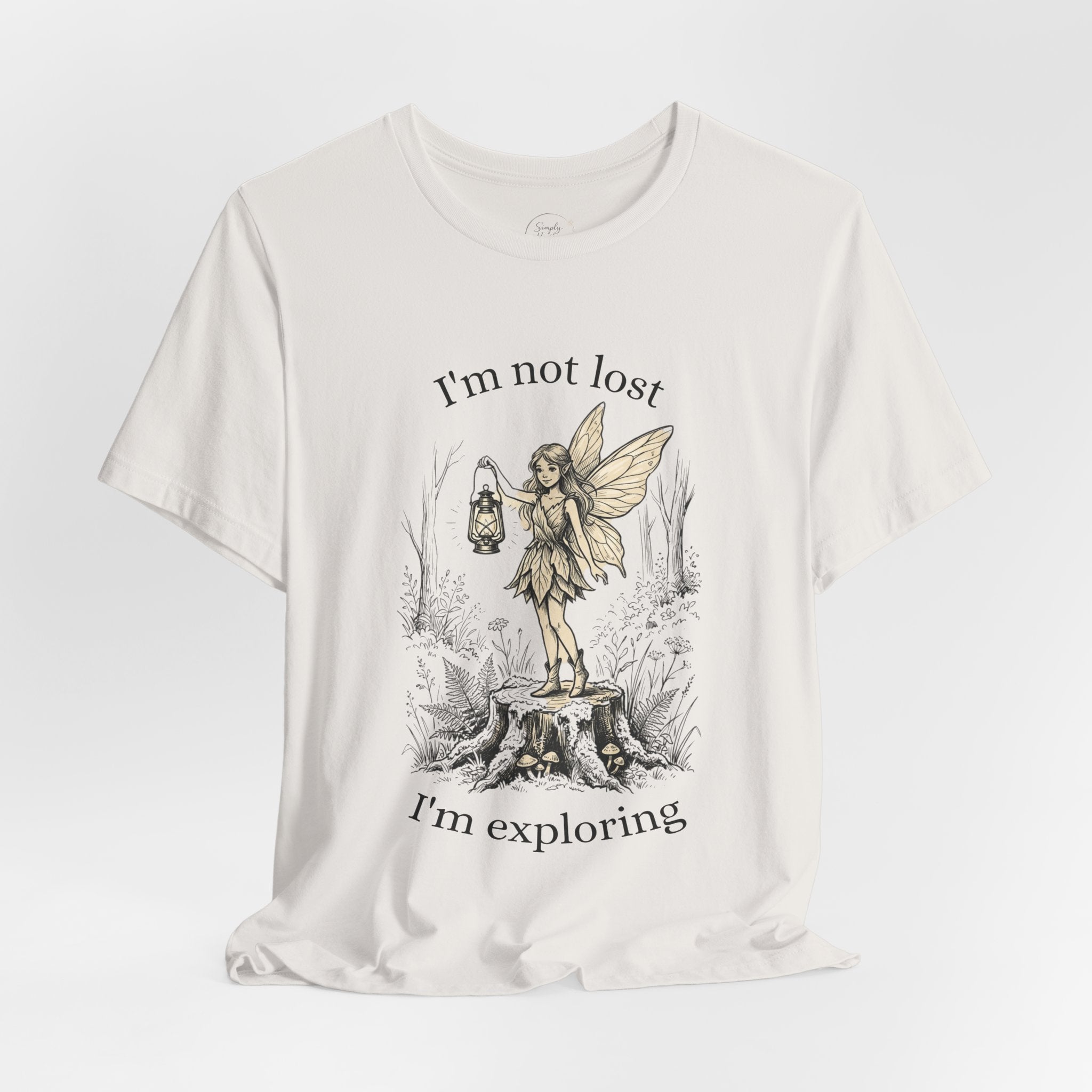 Gray fairy exploration graphic T-shirt by Printify featuring the text "I’m Not Lost, I’m Exploring" on soft cotton fabric.