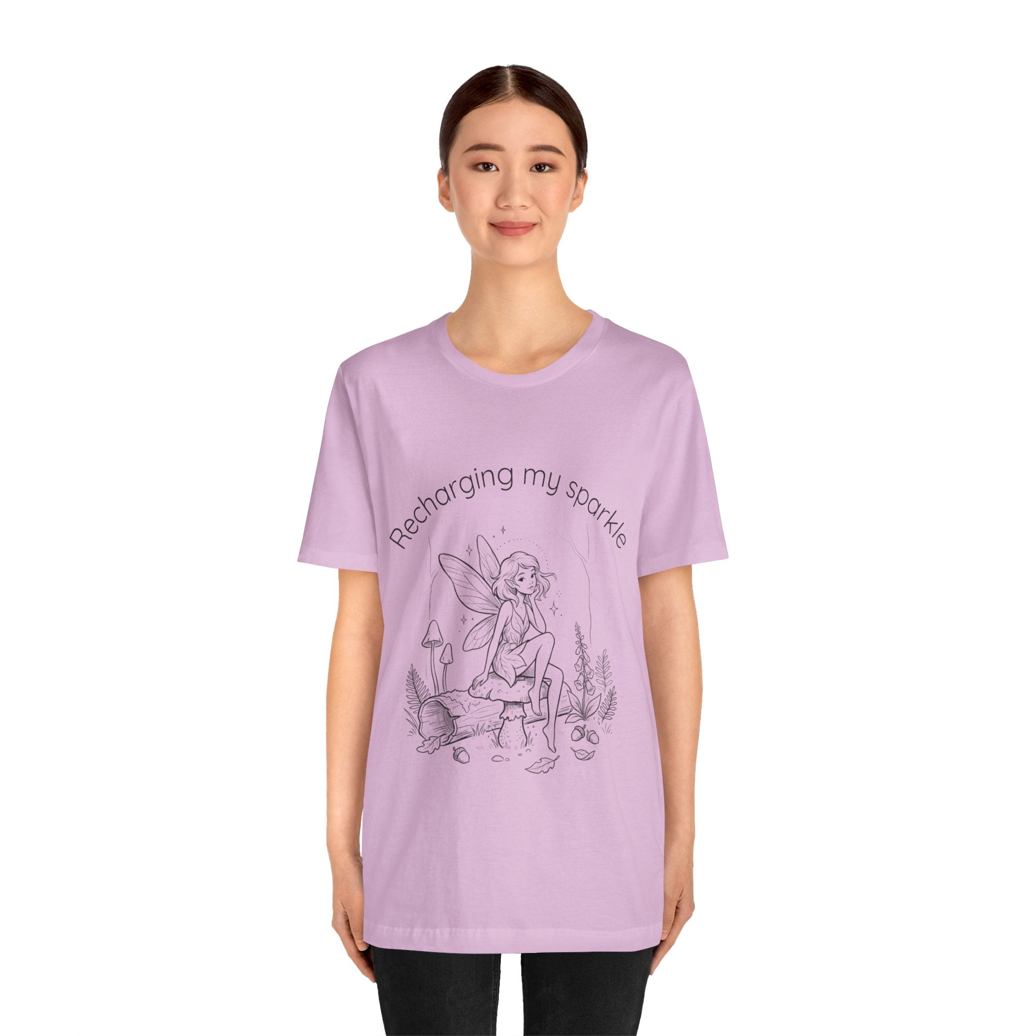 Vintage fairy graphic T-shirt with "Recharging My Sparkle" slogan, featuring colorful fairy design on a Printify T-shirt.