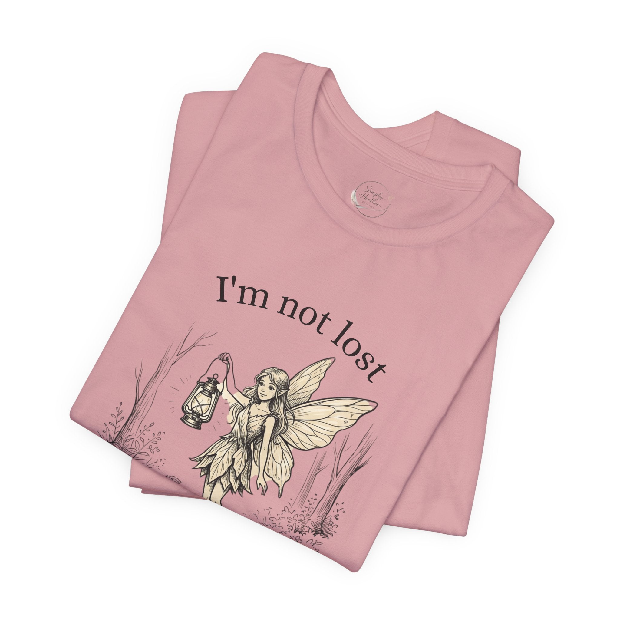 Fairy Exploration Tee by Printify, a graphic T-shirt featuring a whimsical fairy design and the phrase "I'm Not Lost, I'm Exploring."