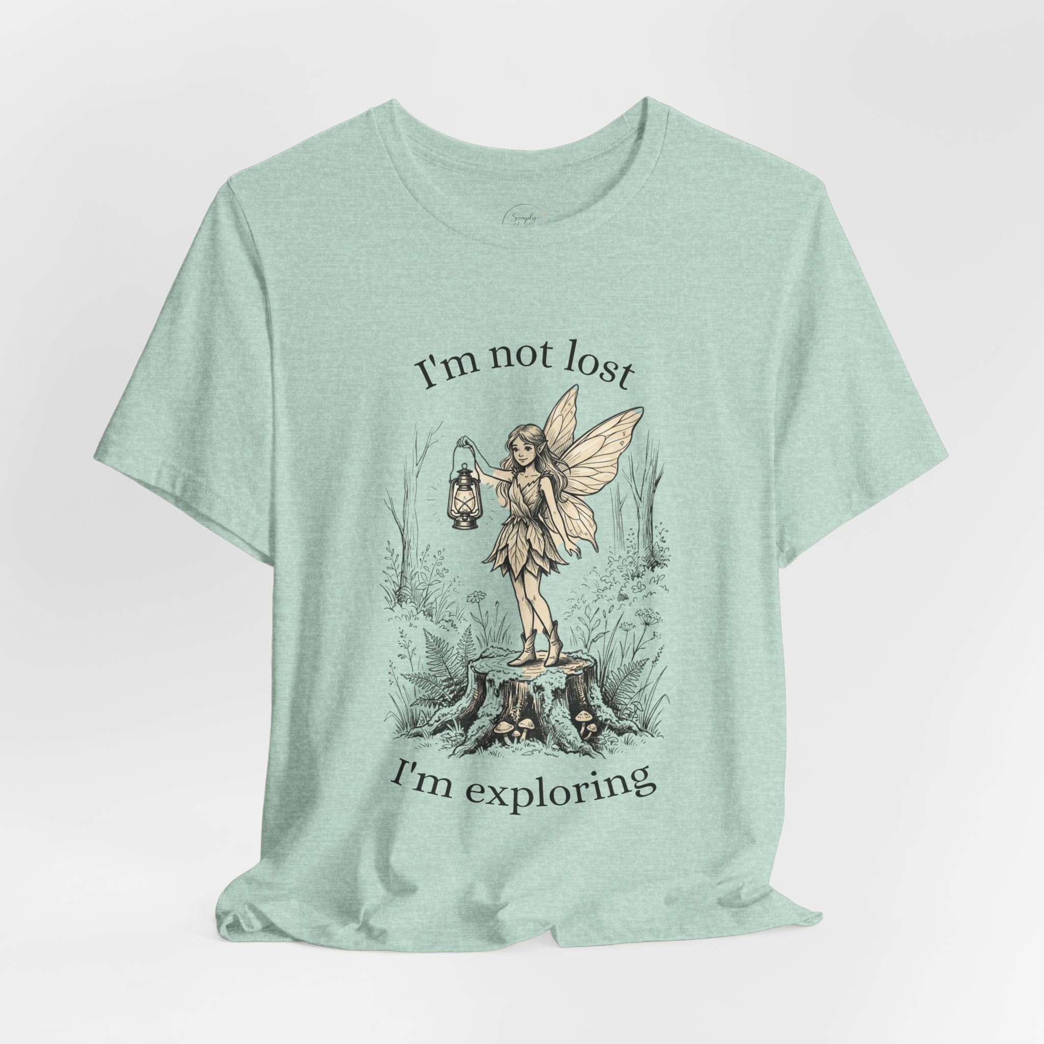 Fairy Exploration Tee by Printify featuring a graphic design with the phrase "I'm Not Lost, I'm Exploring" on a casual T-shirt.