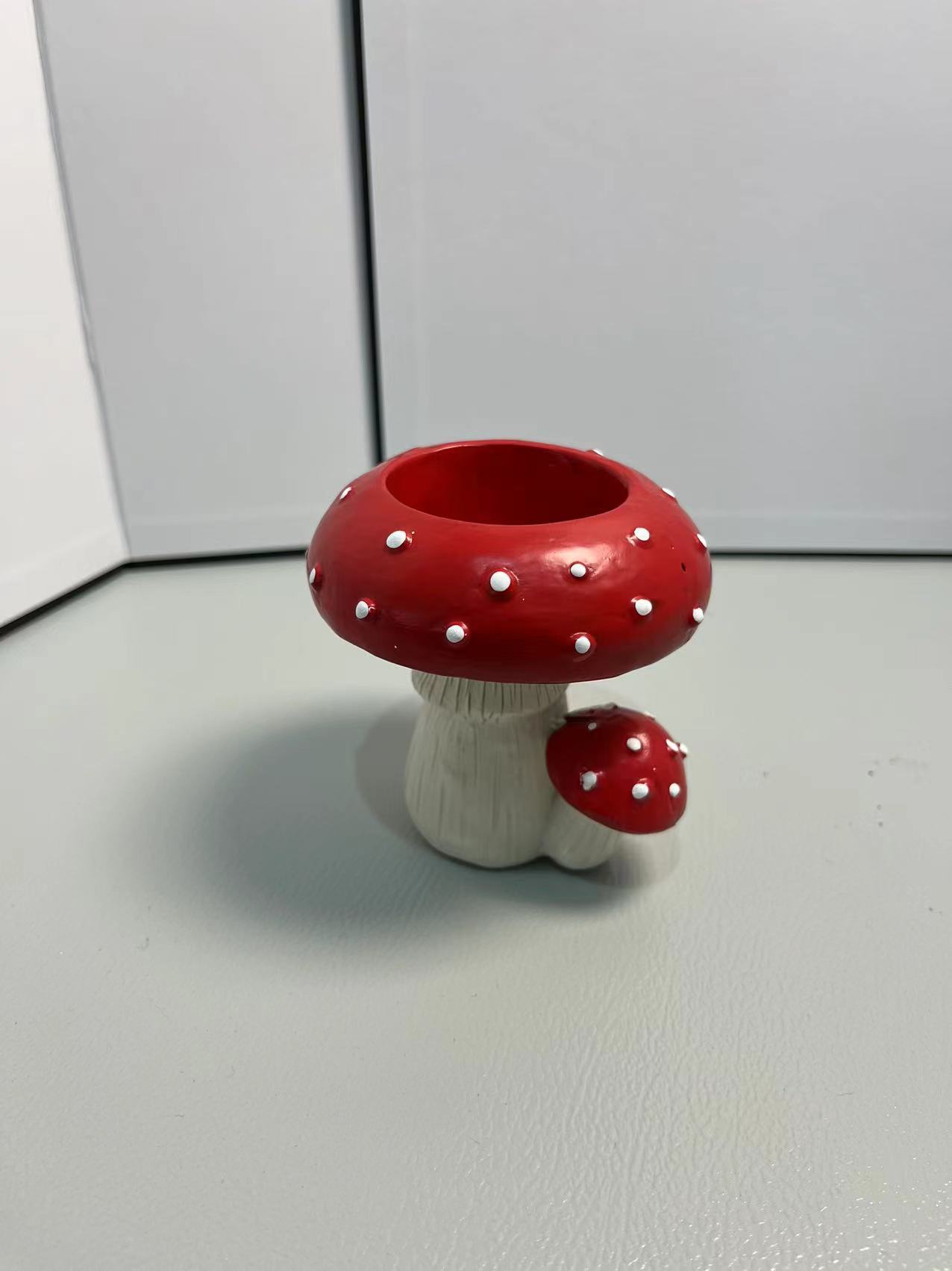 Resin toadstool mushroom woodland candle holder with decorative woodland design, suitable for candles and home decor.