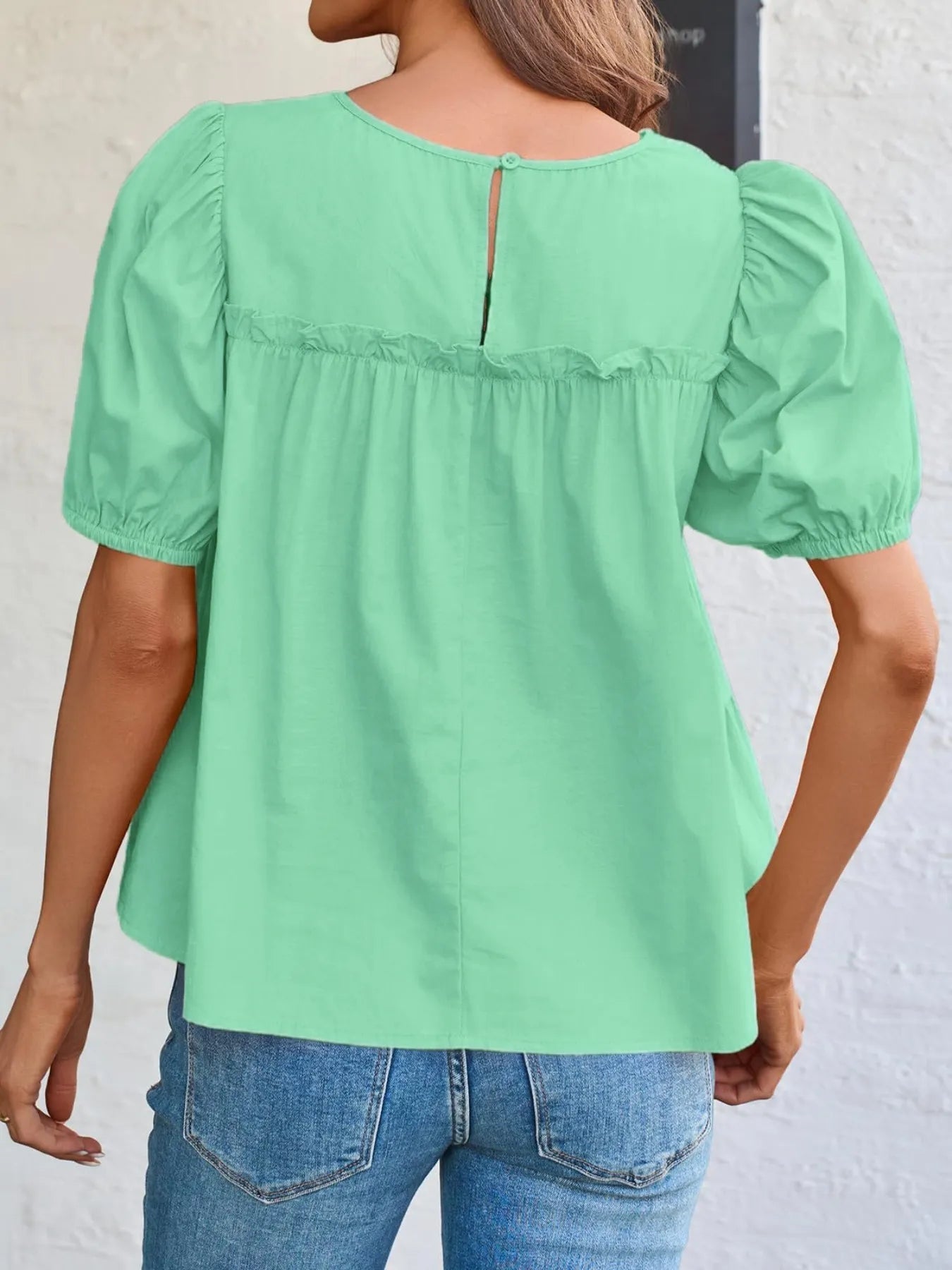 Soft Meadow Silhouette puff sleeve tiered cottage blouse by Trendsi, featuring delicate fabric and tiered design, styled for a feminine look.