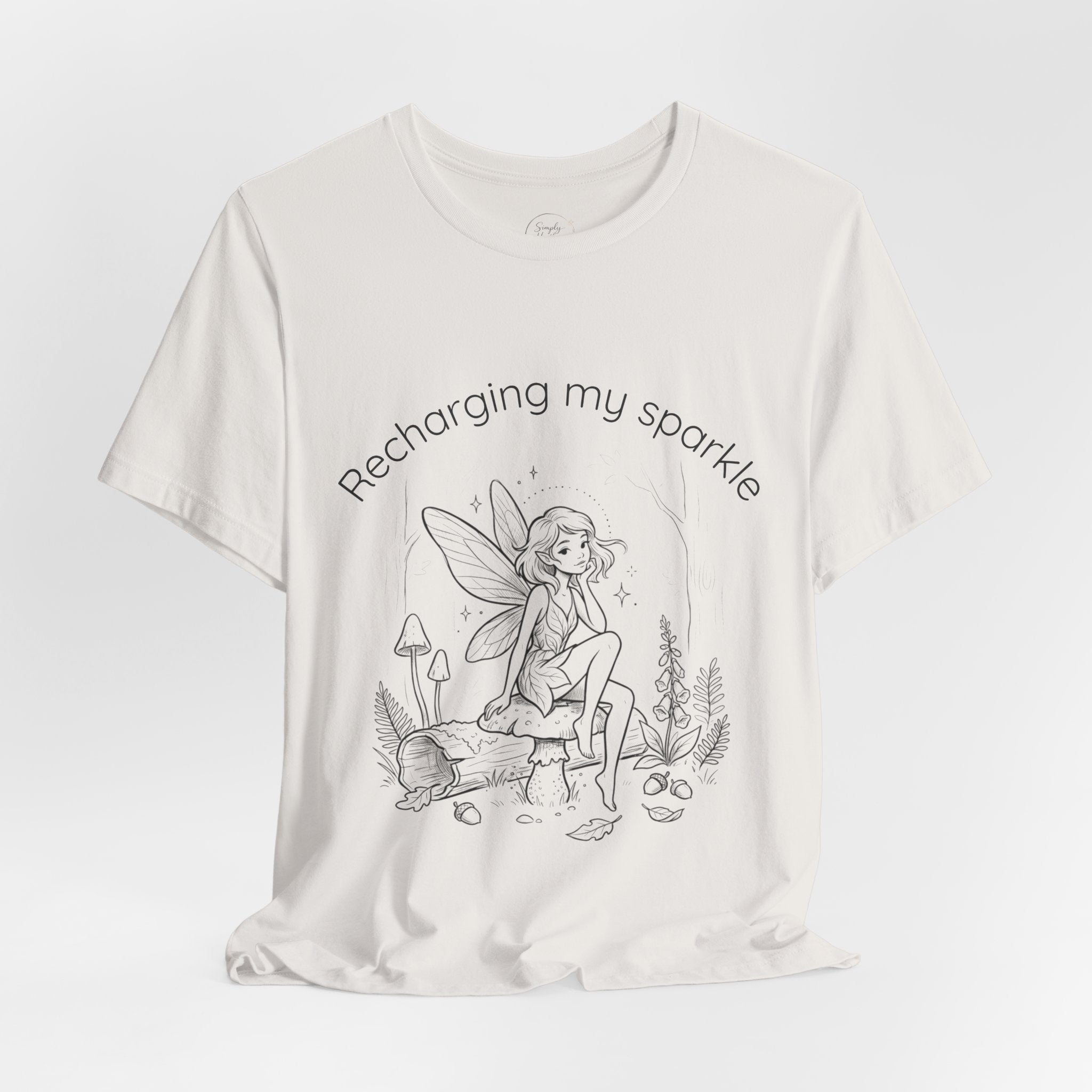 Vintage fairy graphic T-shirt with "Recharging My Sparkle" slogan, featuring whimsical fairy design on a casual Printify T-shirt.