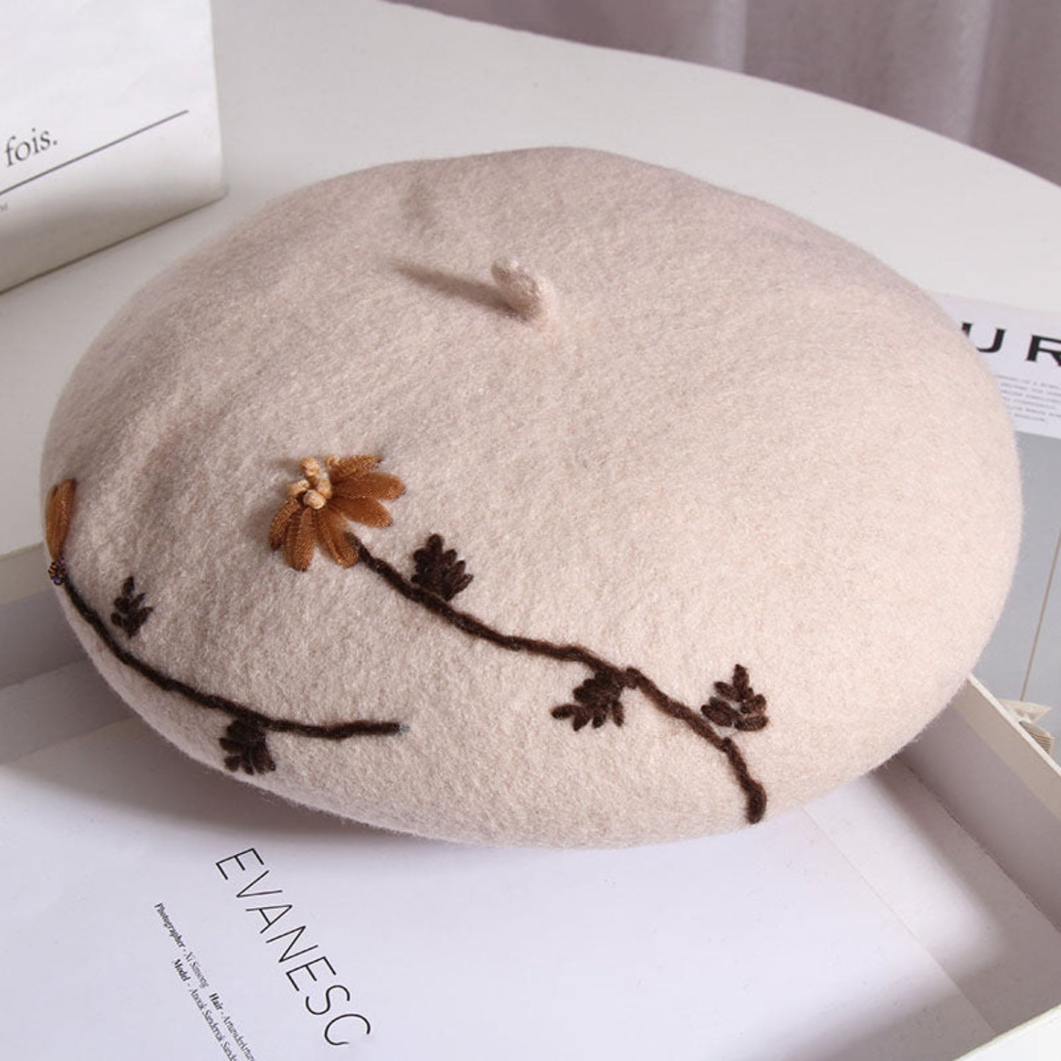 Beige mushroom meadow daisy beret hat with rounded mushroom cap shape and white daisy embroidery, stylish cottagecore accessory.
