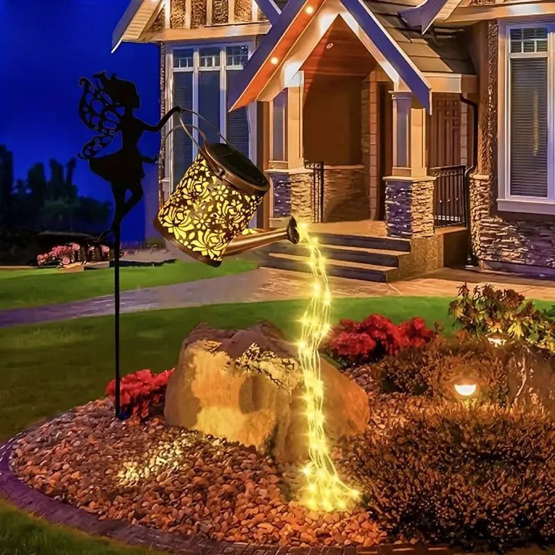 Fairy Watering Can Garden Light by Simply Heather Creative, enchanted yard ornament with a whimsical fairy design and gentle illumination.