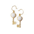 Golden porcelain Camellia earrings with gold accents from POPORCELAIN's Rosehaven Secret Garden jewelry collection.