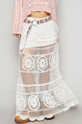 Front view of Hearthside Cottage crochet skirt by Trendsi, featuring intricate crochet details and a flowing, bohemian style.