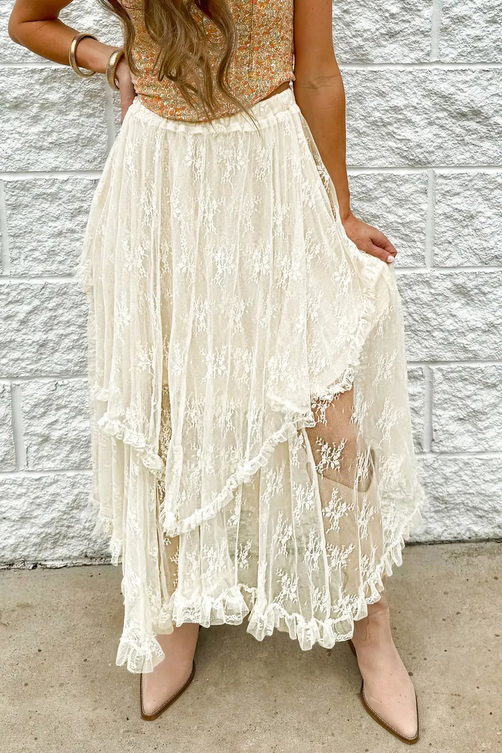 Ivory lace tiered midi skirt with romantic layered design, made by Trendsi, showcasing intricate lace details and flowing silhouette.