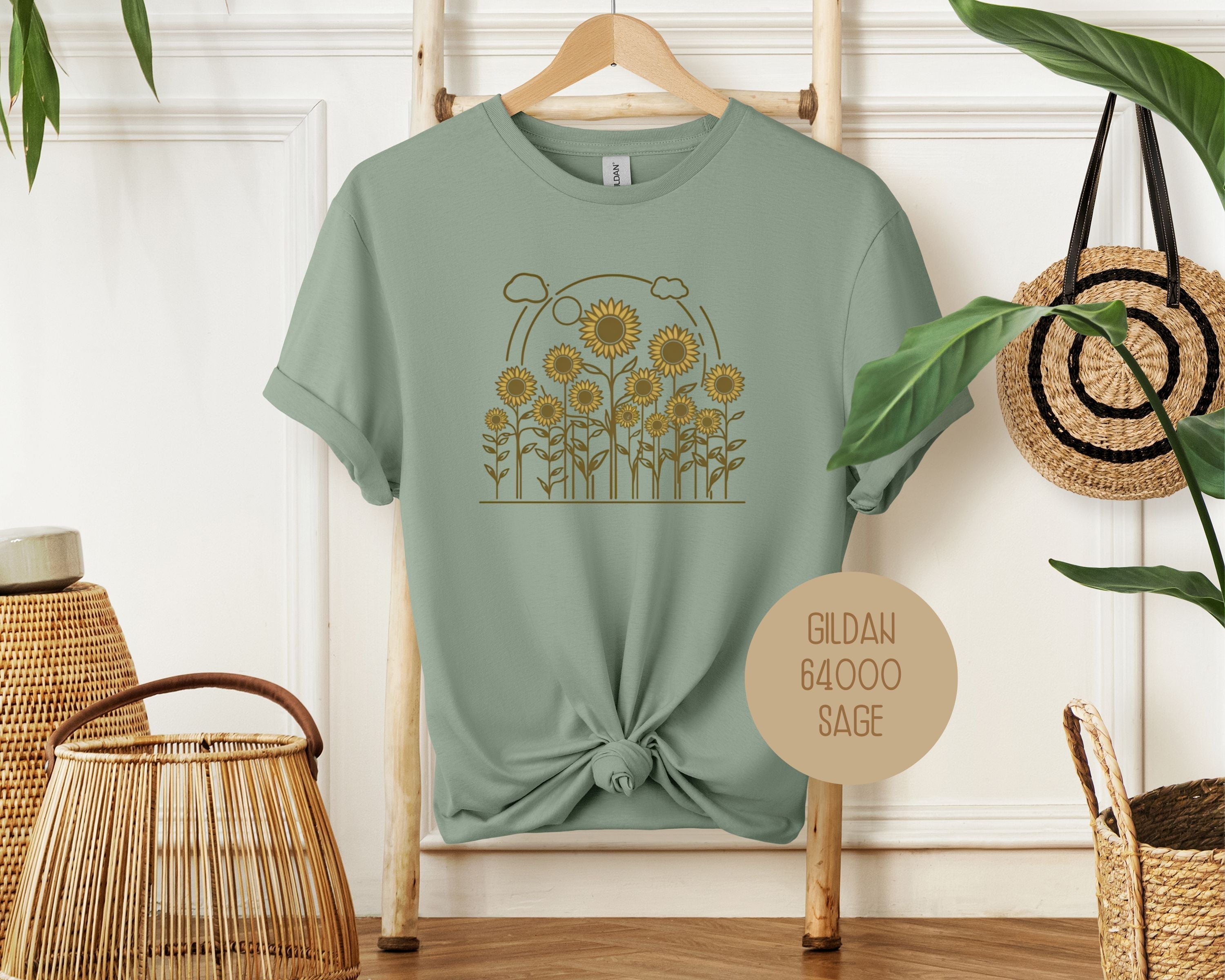 CreativeSpecialTs Rosehaven Cottage vintage sunflower T-shirt in sage green, featuring a detailed sunflower design on the front.