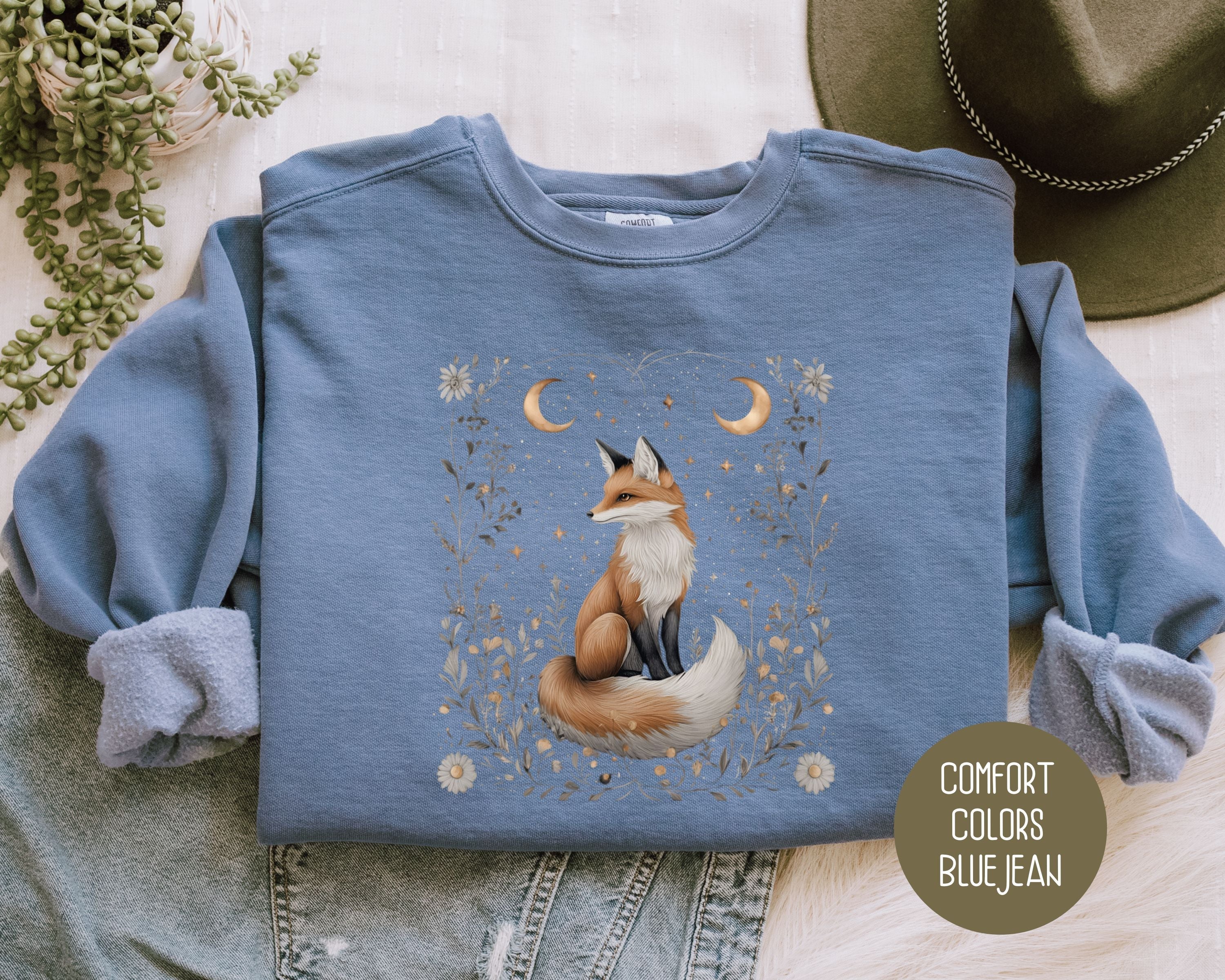 Blue Celestial Fox sweatshirt by CreativeSpecialTs featuring a starlit hollow fox design on the front.