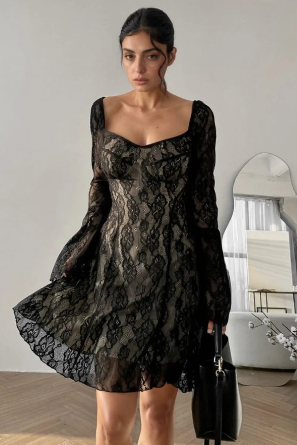Front view of the Starlit Hollow Lace Spell Dress by Trendsi, featuring intricate lace details and a flowing design.