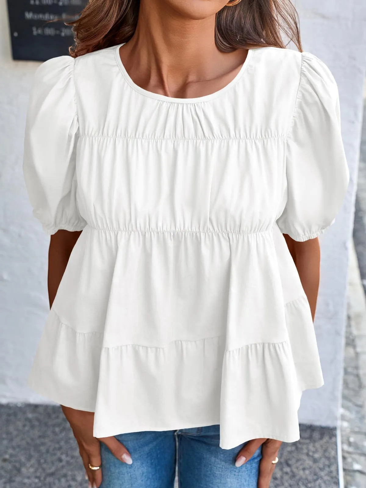 Soft Meadow silhouette puff sleeve tiered cottage blouse by Trendsi, featuring lightweight fabric and feminine ruffle details.