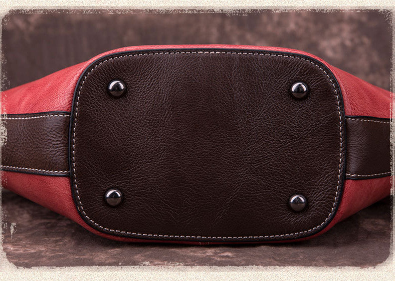 Vintage leather Boston bag by cjdropshipping featuring embossed flower and fairy wishing bottle motif, shown from bottom view.