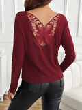 Semi-sheer lace detail long sleeve blouse with butterfly back from Trendsi, featuring elegant lace accents and a stylish, flowing fit.
