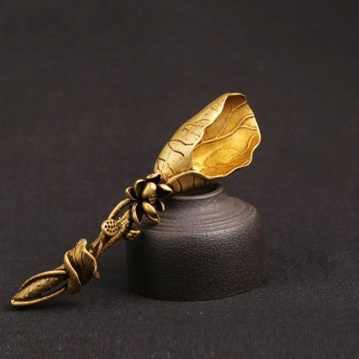 Golden brass lotus leaf tea shovel from cjdropshipping, artisan tea scoop with detailed lotus leaf design, front view.