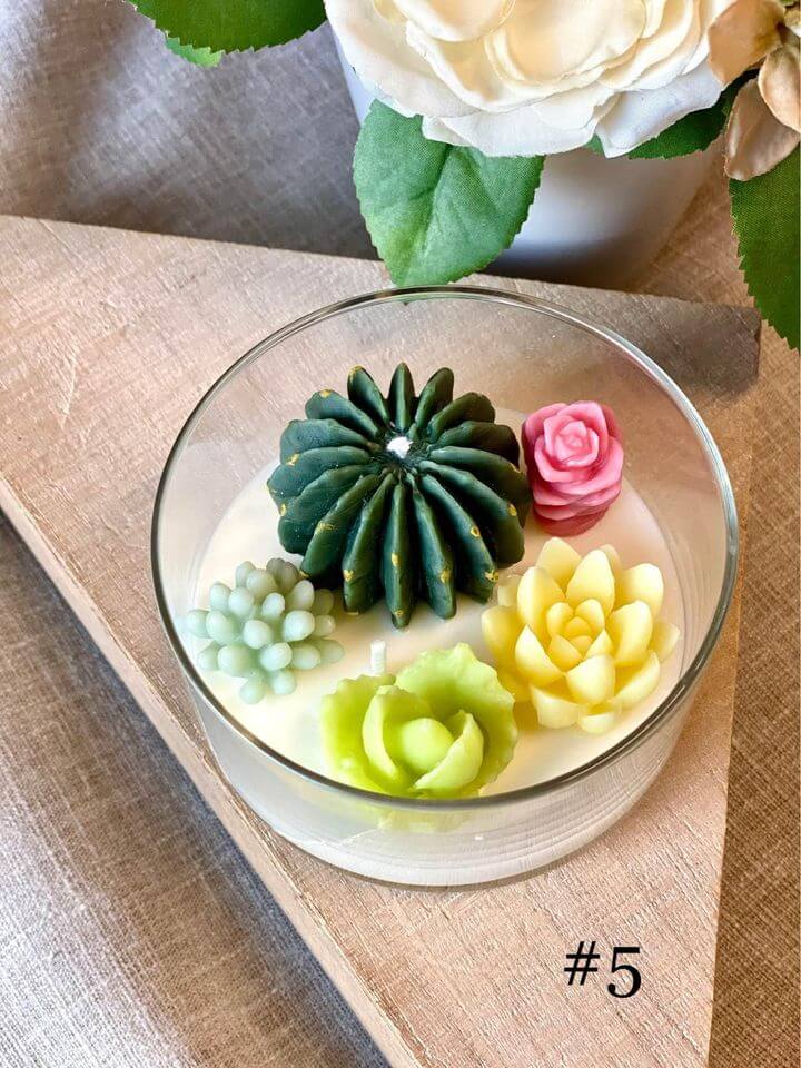 Handmade garden terrarium candle by Crazy About Candles with natural greenery and serene glow, perfect for home decor.