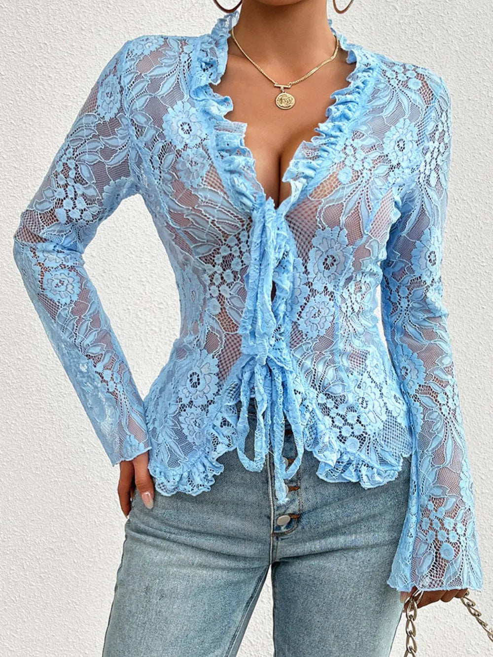 Light blue lace-tied V-neck blouse with sheer sleeves, stylish and feminine, from Trendsi.