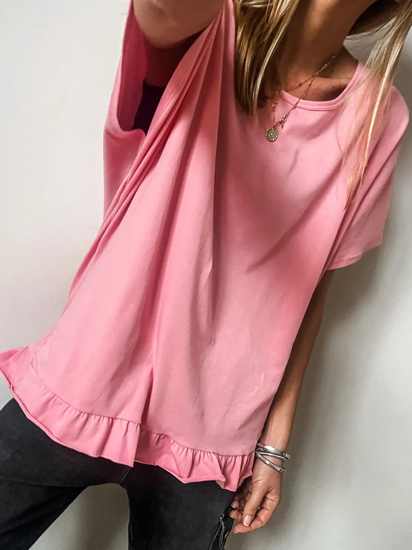 Pale blush ruffle hem cottage T-shirt with round neckline, front view, casual style, trendy and comfortable women's top.