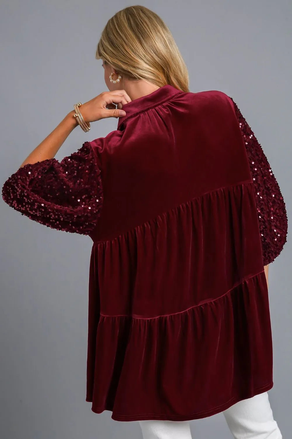Pink Starlit Wine Sequin Tiered Back Blouse by Trendsi, featuring shimmering sequins and a tiered design with a stylish back detail.