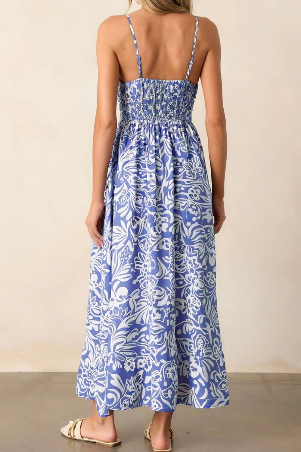 Whimsical bluebell Reverie sundress with spaghetti straps, back view showing flowing fabric and relaxed fit, casual summer style.