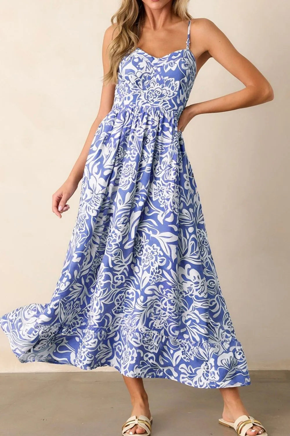 Whimsical bluebell-colored sundress with spaghetti straps, front view on a model, perfect for warm weather and casual outings.